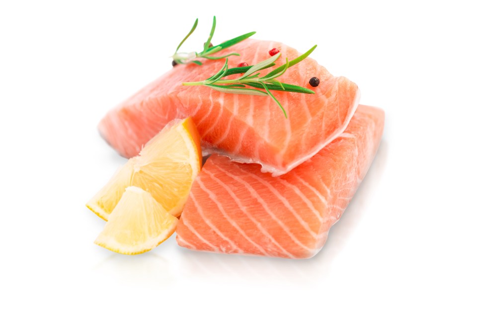 Salmon steaks with rosemary, peppercorns, and lemon slices.