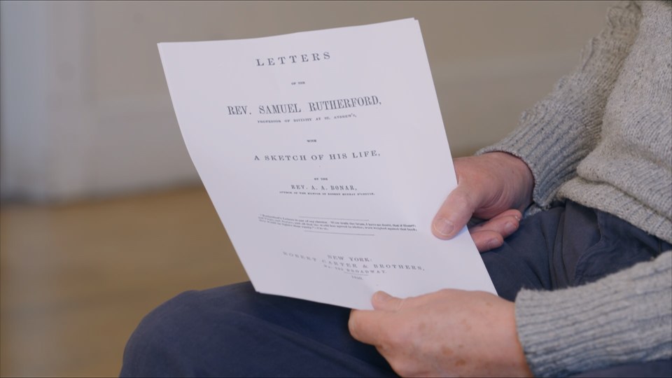 Person holding a book titled "Letters of the Rev. Samuel Rutherford, with a sketch of his life".
