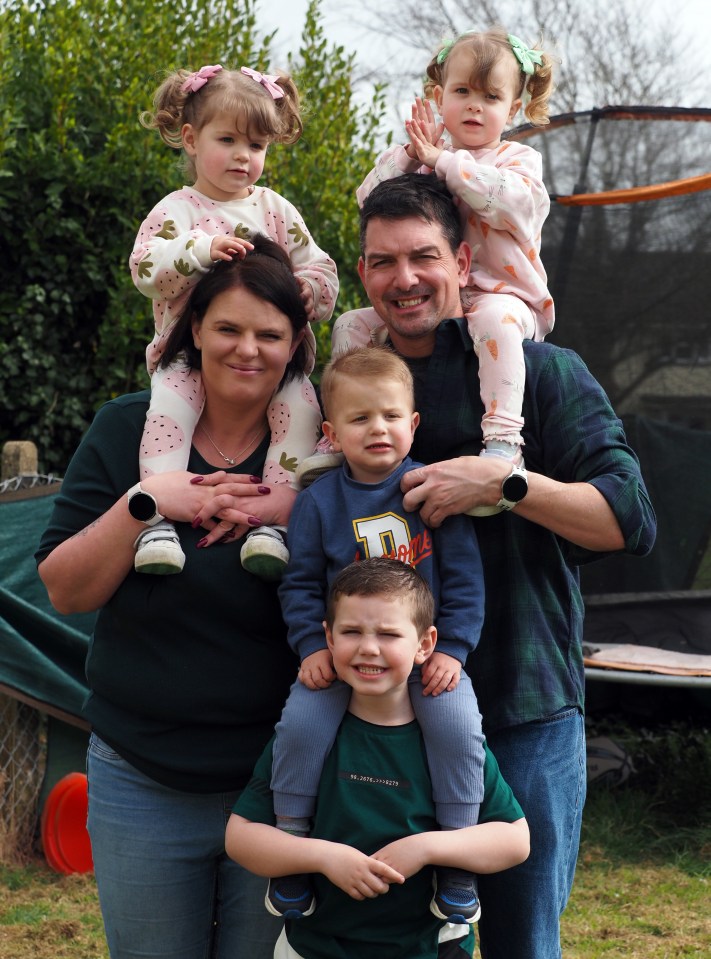 Family portrait of parents with their five children.