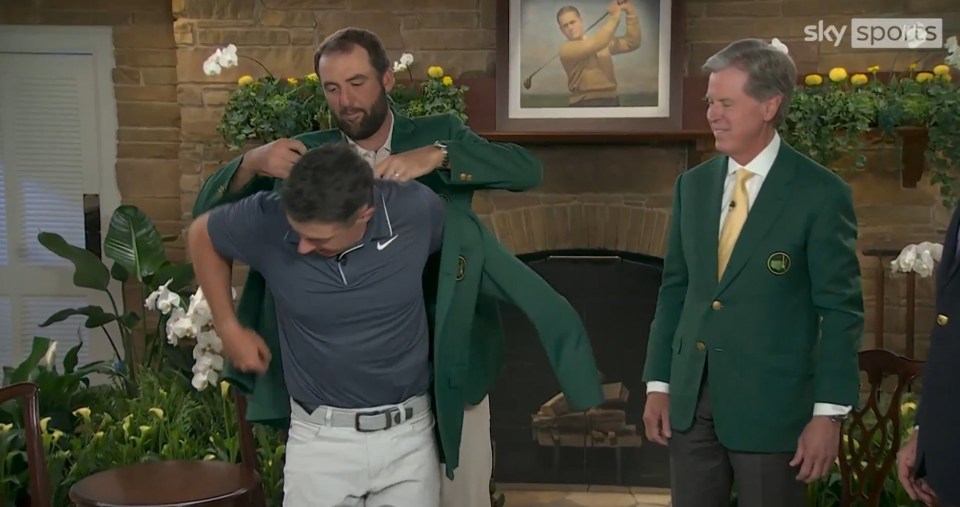 Scottie Scheffler putting on the green jacket.