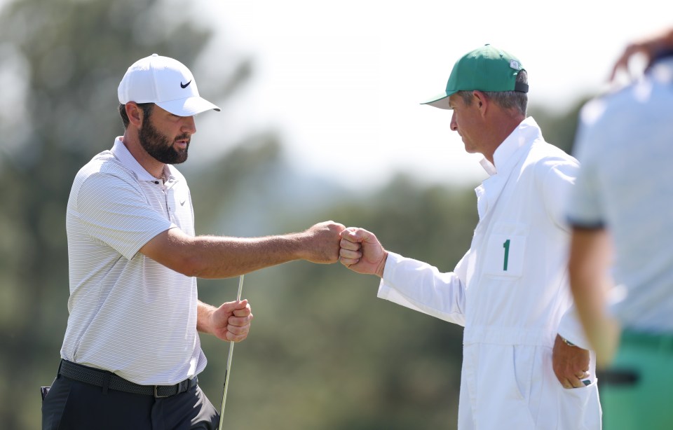 Scheffler and caddie Ted Scott celebrate a job well done