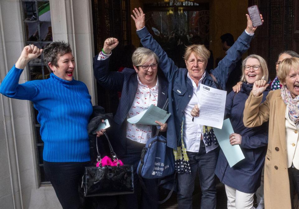 Women celebrating a Supreme Court ruling.