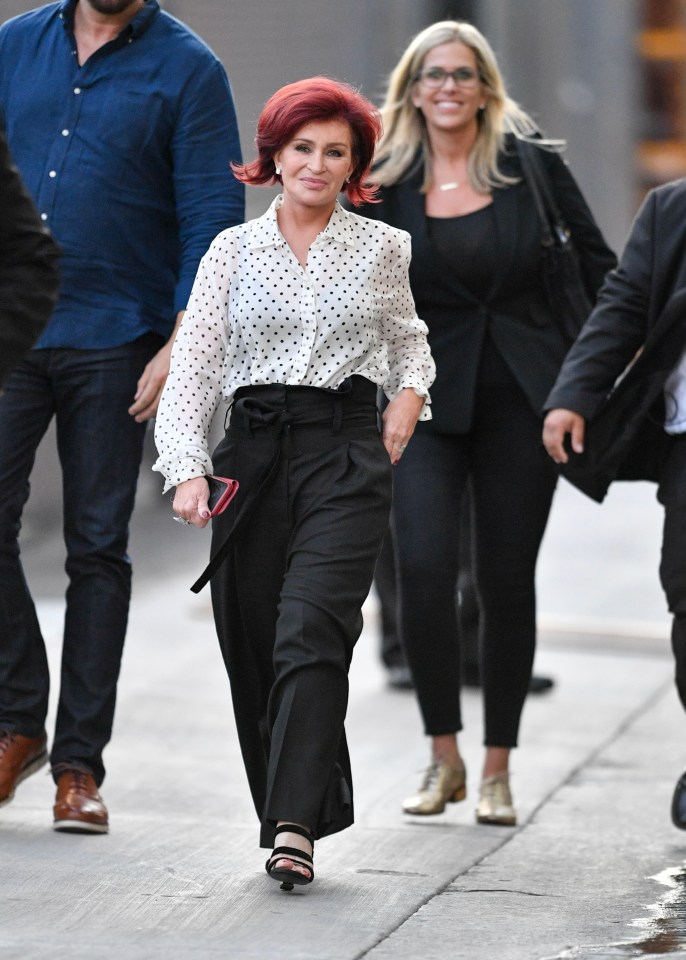 Sharon Osbourne walking down the street.