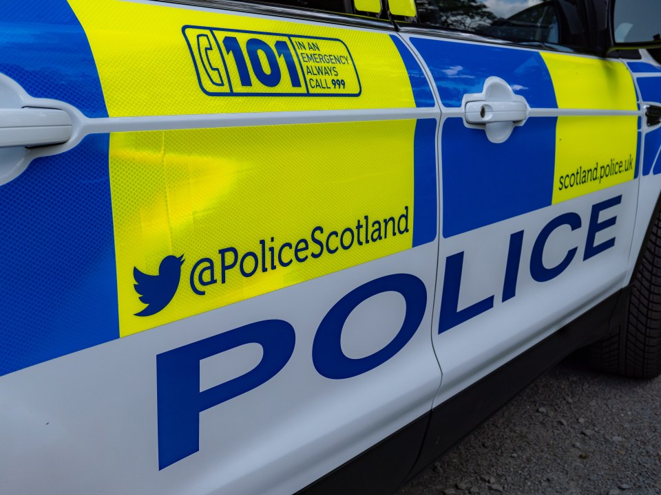 Side view of a Police Scotland vehicle with contact information.
