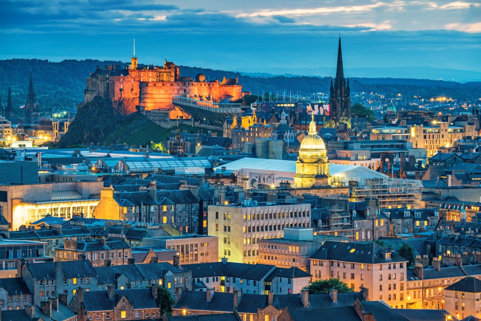 Edinburgh skyline at twilight, featuring Edinburgh Castle.