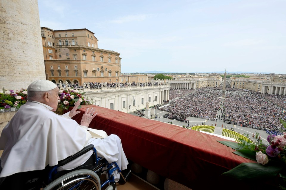Pope Francis delivering his Urbi et Orbi blessing from a balcony overlooking St. Peter's Square.