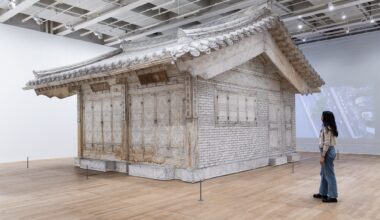 a life-size installation of a traditional Korean home made of white fabric in a gallery space