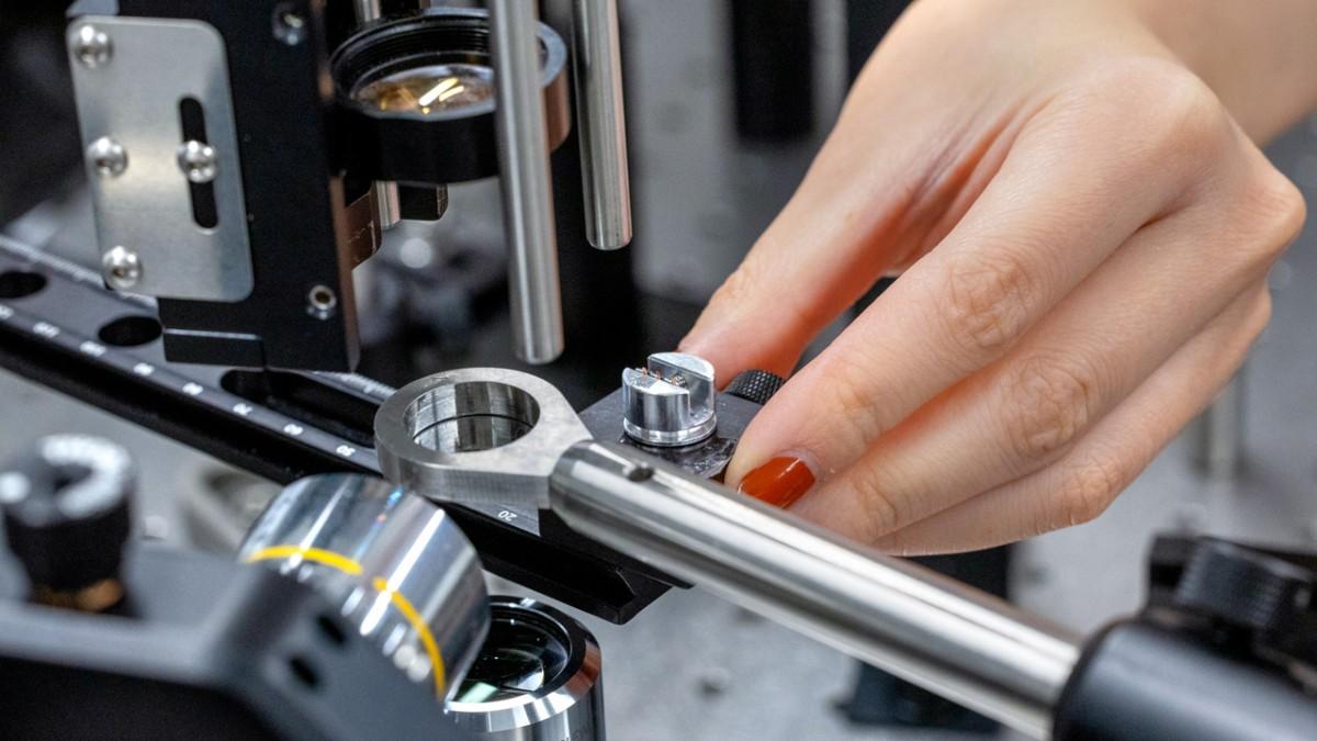 In the Hassani Group lab, a microprojectile launcher accelerates metal particles to supersonic velocities, with high-speed cameras capturing the moment of impact.