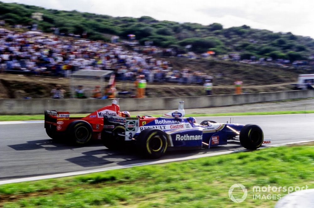 The controversial collision between Michael Schumacher, Ferrari F310B, and Jacques Villeneuve, Williams FW19 Renault
