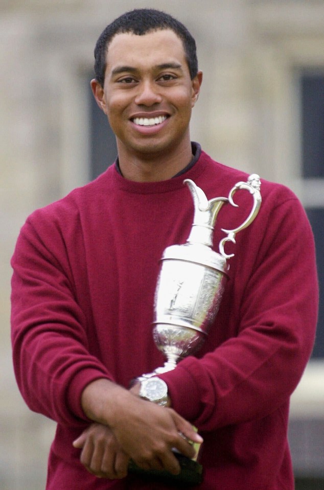Tiger Woods holding the Claret Jug after winning the British Open.