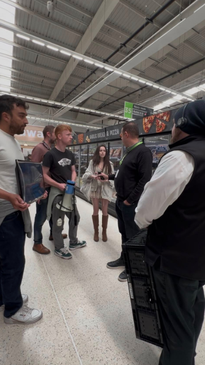 Animal rights protesters demonstrating in an Asda supermarket.