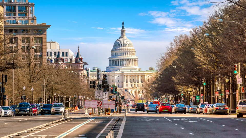 View of the United States Capitol building in Washington, D.C., from a street.