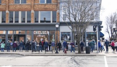 See how a Michigan town moved 9,100 books one by one to their new home