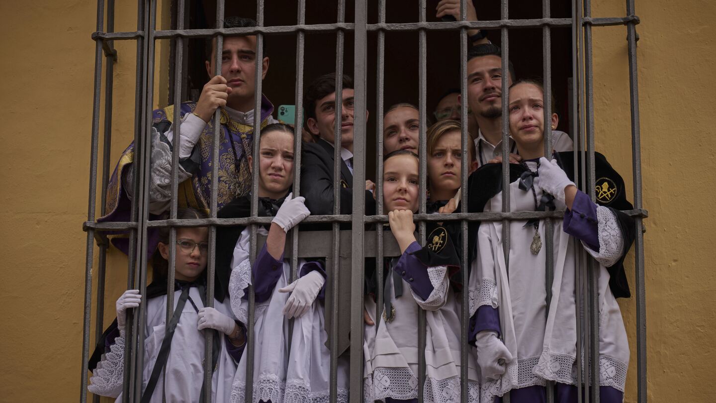 AP PHOTOS: Rain or shine, emotions run high at Seville's Holy Week processions in Spain