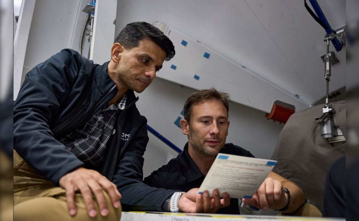 Shubhanshu Shukla and Slawosz Uznanski, review a procedure checklist card during training within