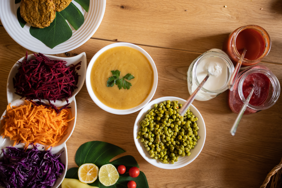 Vegetables and soup on table