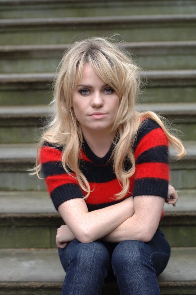 Duffy, Welsh singer-songwriter, seated on steps.