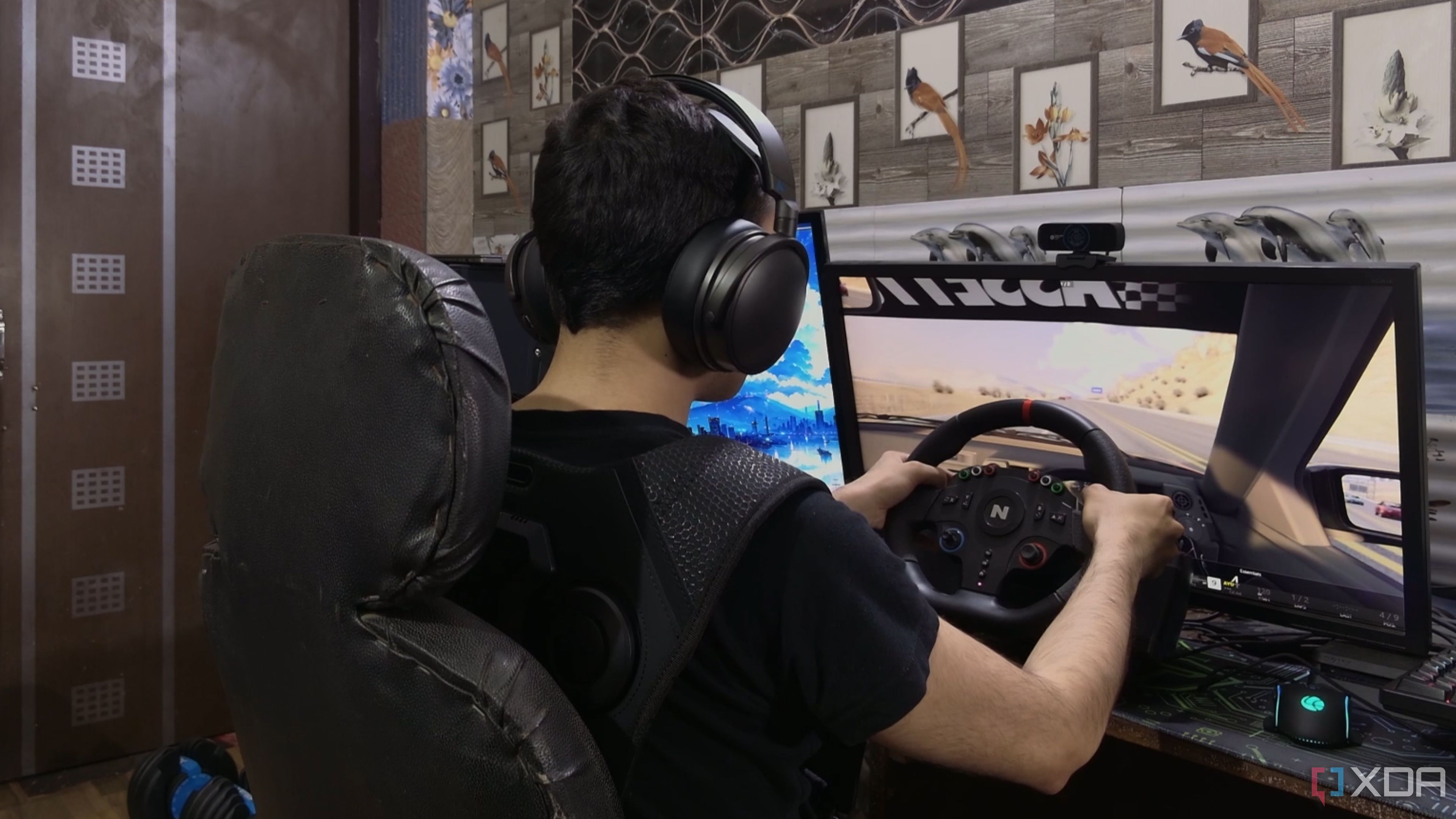A person playing Assetto Corsa while wearing the Woojer Vest 3