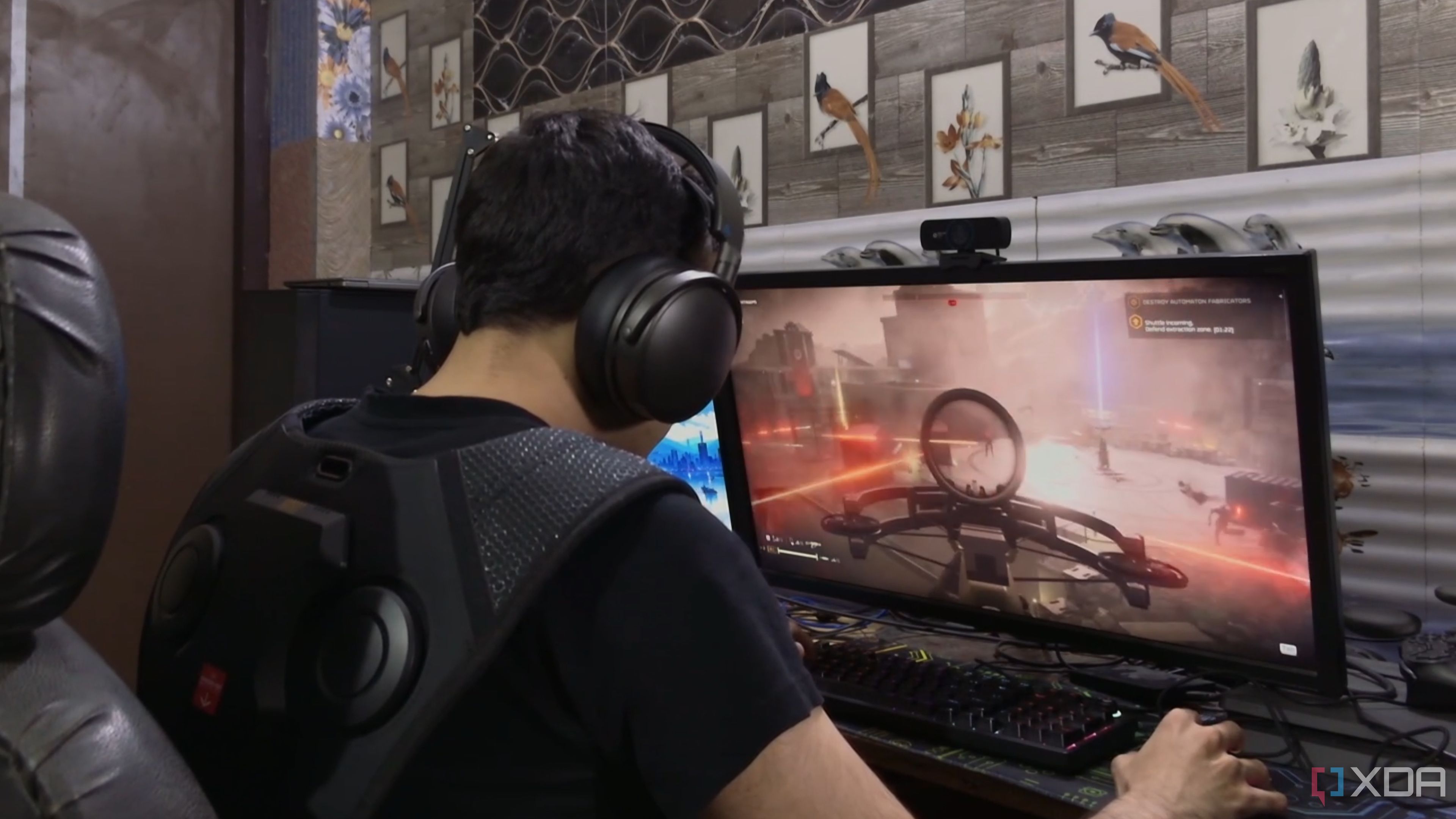 A person playing Helldivers 2 while wearing the Woojer Vest 3