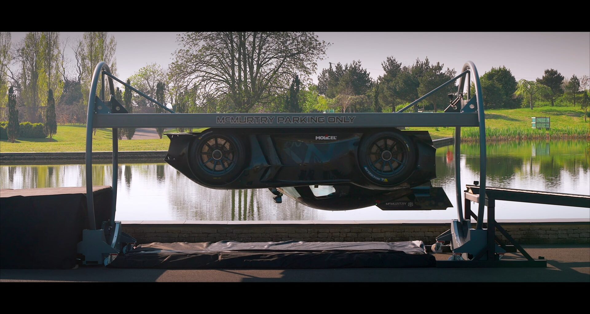 World's first car to drive UPSIDE DOWN is unveiled after 1,000bhp motor 'sucked itself' to ceiling & rotated 180 degrees