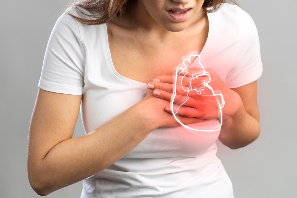 Woman experiencing chest pain, illustration of heart superimposed.