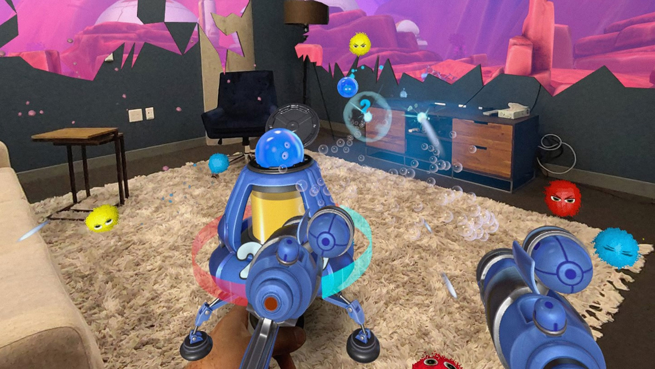 A first-person view of a virtual reality game where there is an animated toy-looking gun in the bottom right with a small spaceship in the middle of a room featuring small ball-shaped aliens and a pink/purple colored background.