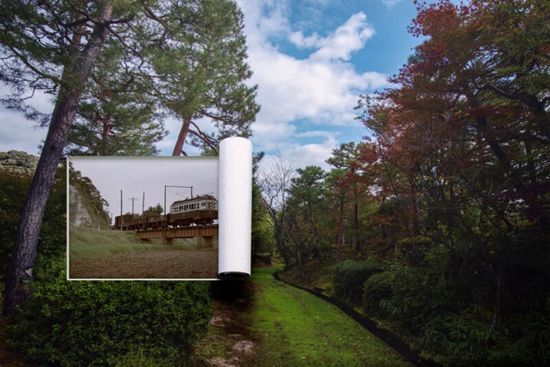 A large photo print of a black-and-white urban scene is unrolling over a vibrant, green forest path, blending the city image into the colorful natural landscape under a blue sky with clouds.