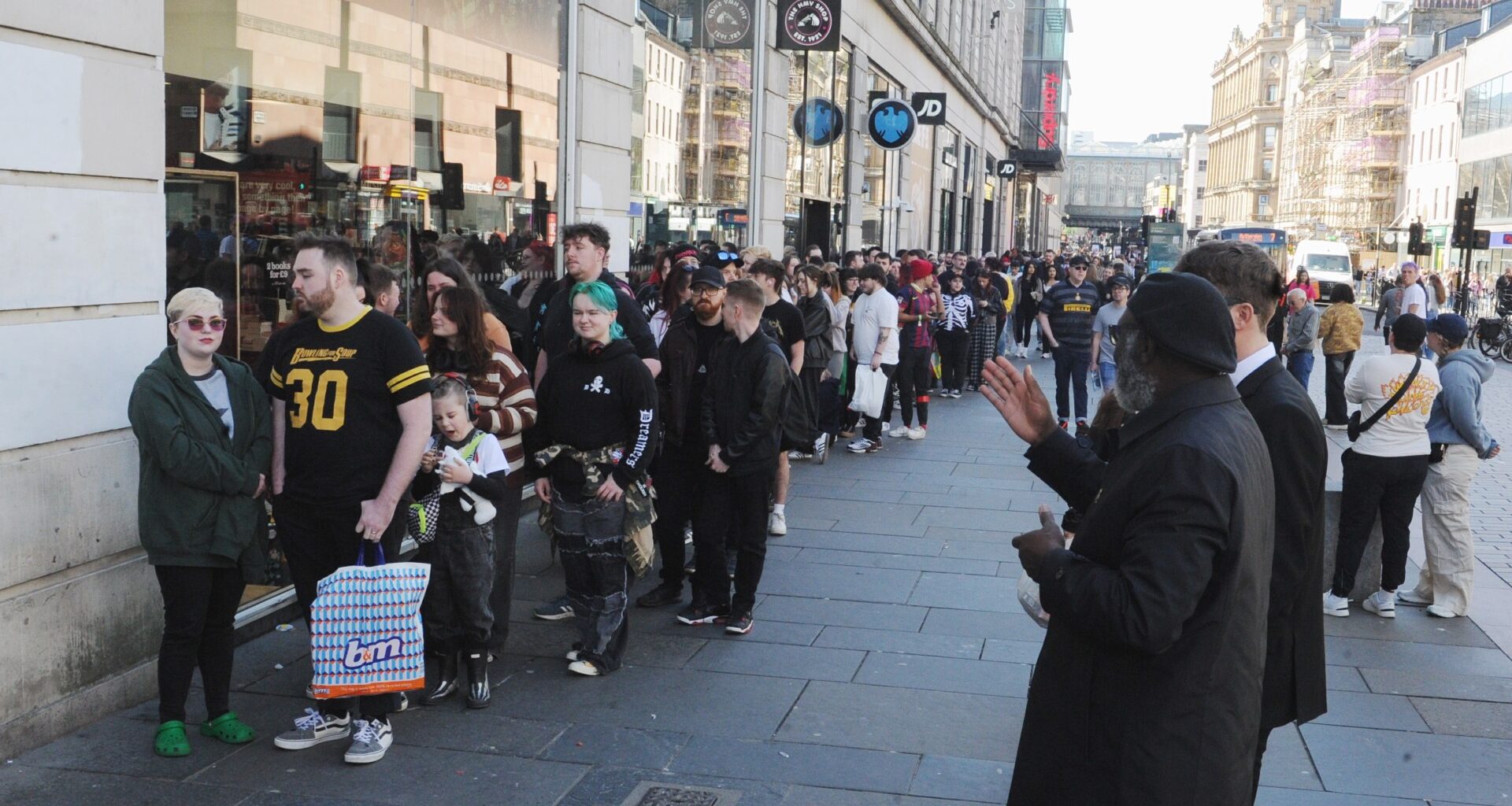 Hundreds of fans spotted queuing on busy Glasgow street to meet chart-topping US band