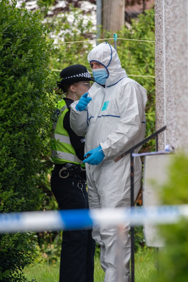 Police officers at a crime scene.