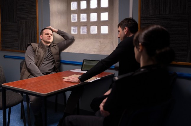 Kit questions Mick in the police station in Corrie