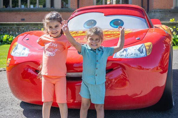 Zaki Gubran with his sister Zahra meeting Lightning McQueen