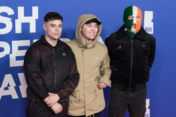 Naoise o Caireallain, Mo Chara, and DJ Provai of Kneecap at an event in 2024.