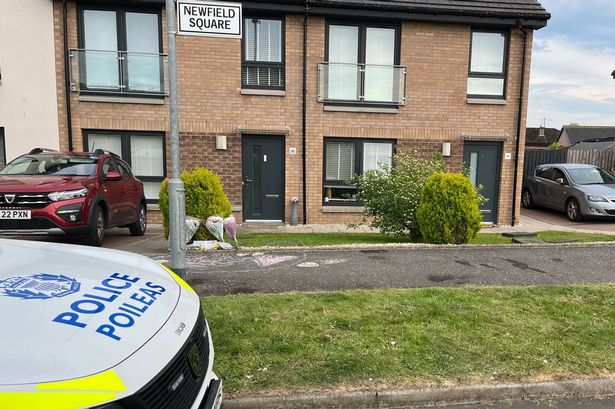 Flowers have been left outside the home in Nitshill
