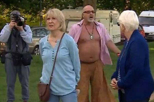 A screenshot from BBC footage showing a man confront a woman on Clifton Down in Bristol