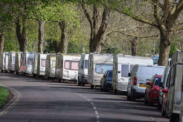 A view of vans and caravans by the side of a road in Clifton Down
