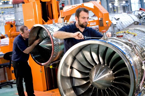 Rolls-Royce engineers working on an aircraft engine thruster 