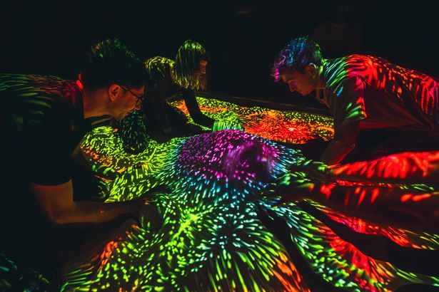 The experience will feature neon sandpits and AI chatbots you can interact with