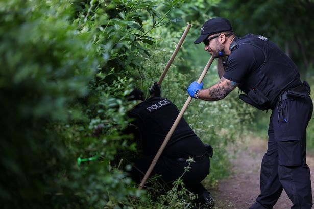 Police Operational Support officers conducting a search of Arnos Park near Brislington, Friday 23  May 2025, where they are looking for knives in undergrowth. 