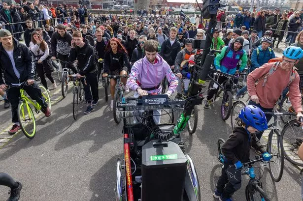 Thousands join DJ Dom Whiting as he rides through the streets of Bristol 