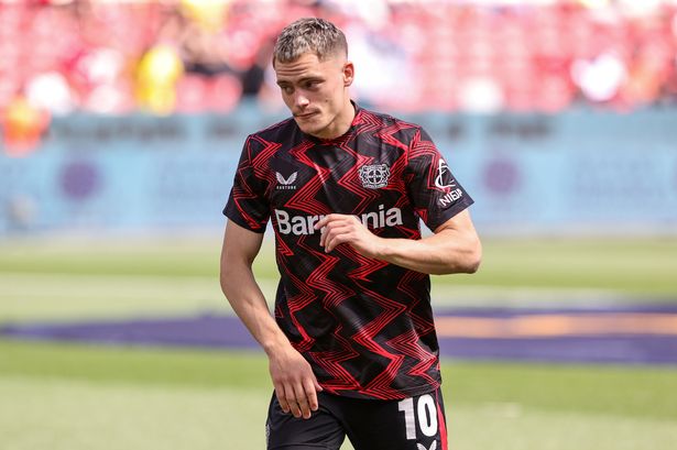 Florian Wirtz warms up during the Bundesliga match between Bayer 04 Leverkusen and Borussia Dortmund. 