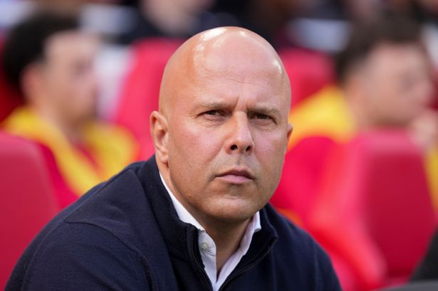 Liverpool's manager Arne Slot takes his seat before the clash with Tottenham