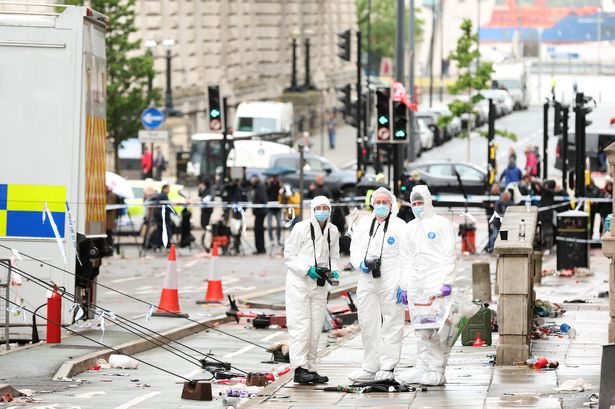 Crime Scene Investigators at the scene of the Liverpool FC parade incident on Water Street on May 27, 2025
