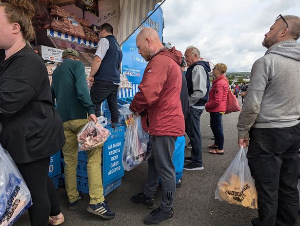 Customers queuing at the car boot for 'the meat man'