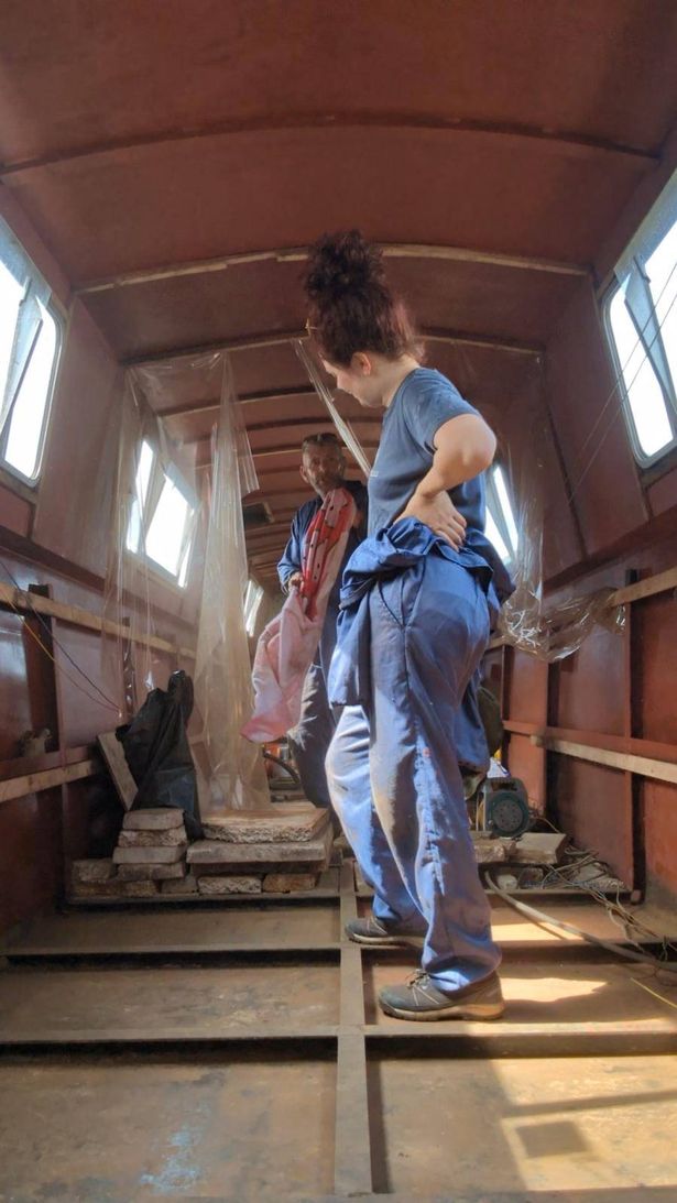 El standing in her narrowboat while renovations are underway