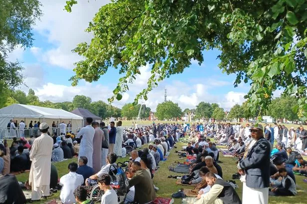 Worshippers gather for Eid ul Adha morning prayers in Small Heath Park, Birmingham, in the sunshine of July 2022
