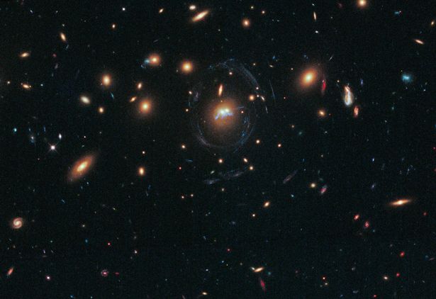NASA's Hubble Space Telescope has photographed the dense galaxy cluster SDSS J1531+3414 in the northern constellation Corona Borealis. 