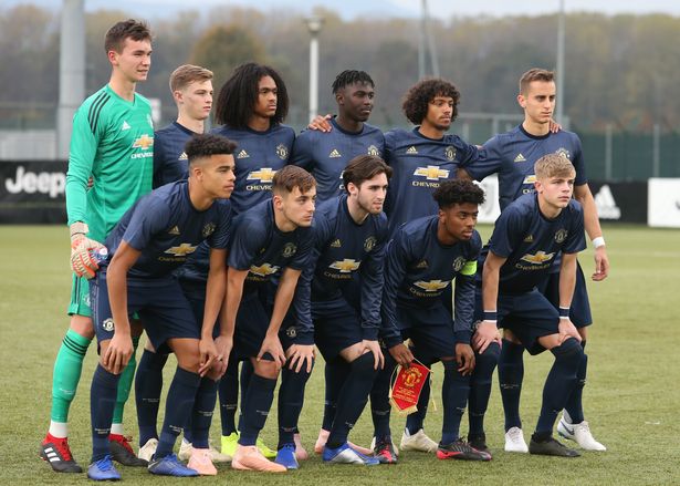 The Manchester United starting eleven line up for a team photo prior to kick off, back row ( L to R ); Matej Kovar, George Tanner, Tahith Chong, Aliou Badara Traore, D'Mani Bughail-Mellor and Luca Ercolani, ( Front row L to R ); Mason Greenwood, Lee O'Connor, Aidan Barlow, Angel Gomes and Brandon Williams during the UEFA Youth League match between Juventus and Manchester United on November 07, 2018 in Vinovo, Italy. (Photo by Jonathan Moscrop/Getty Images)