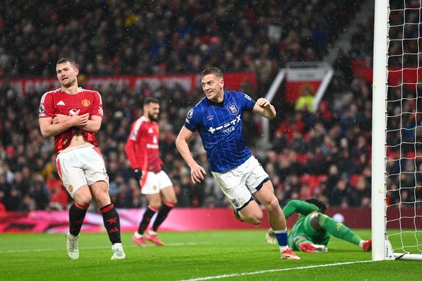 Liam Delap wheels away to celebrate after scoring for Ipswich Town against Manchester United at Old Trafford.