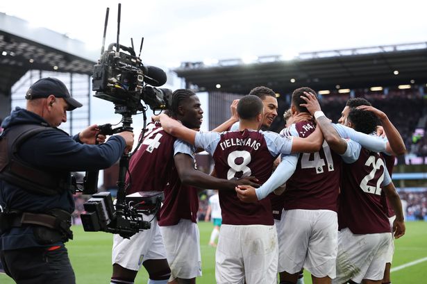 A TV cameraman captures an Aston Villa goal celebration