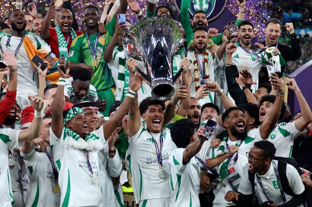 Roberto Firmino of Al-Ahli Saudi lifts The AFC Champions League Elite trophy